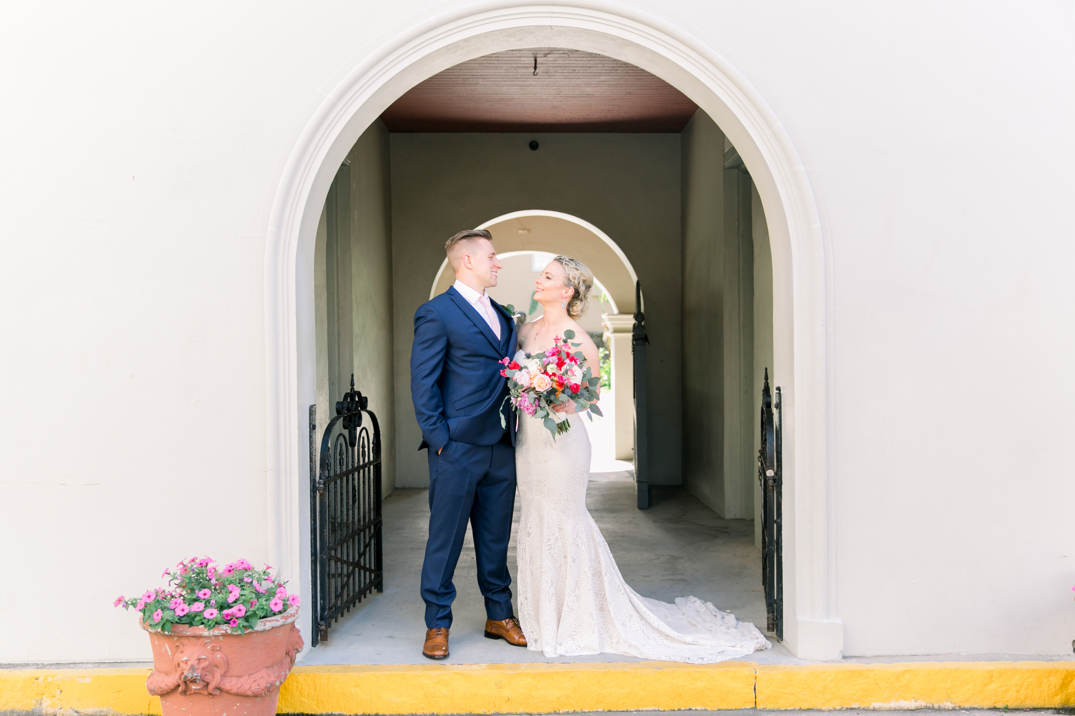 Couple standing together in arch way saint augustine florida