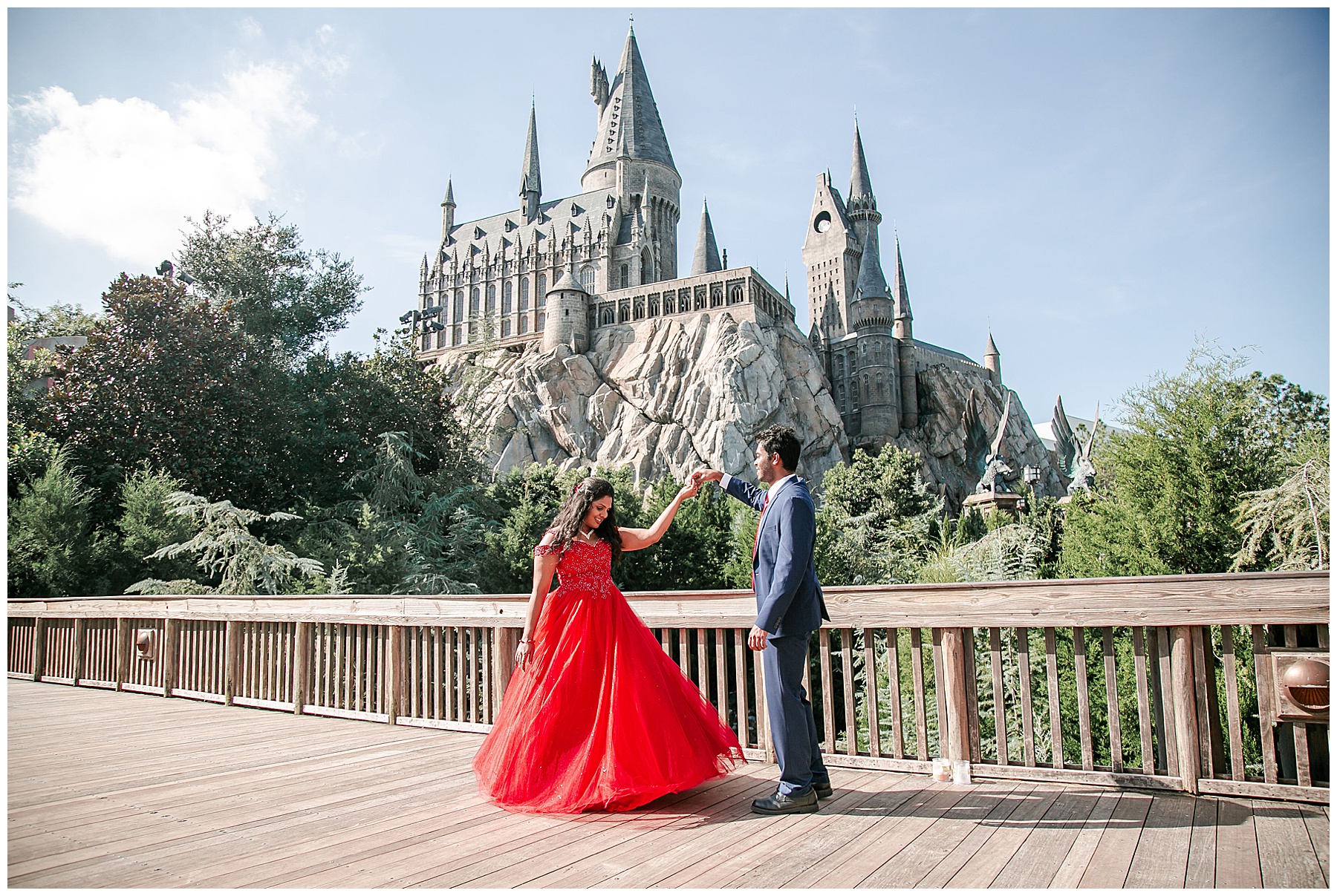 couple dancing in front of Hogwarts castle at universal Orlando